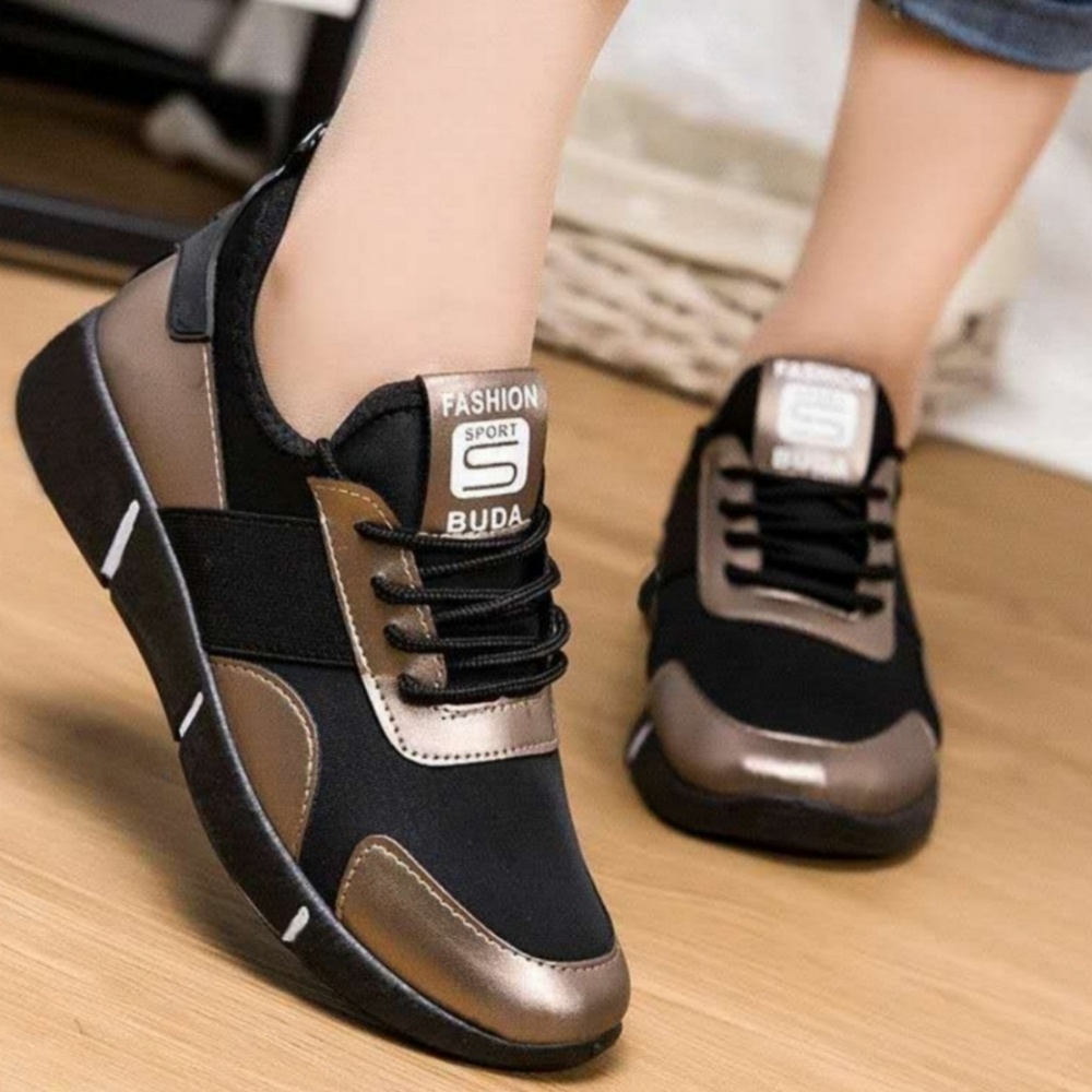***SOLD***Woman's gold and black tennis shoes